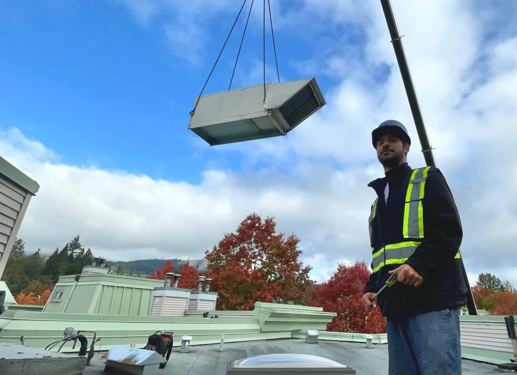 Pure Mechanical Group coordinating a crane lift of a rooftop make-up air unit at a Metro Vancouver property