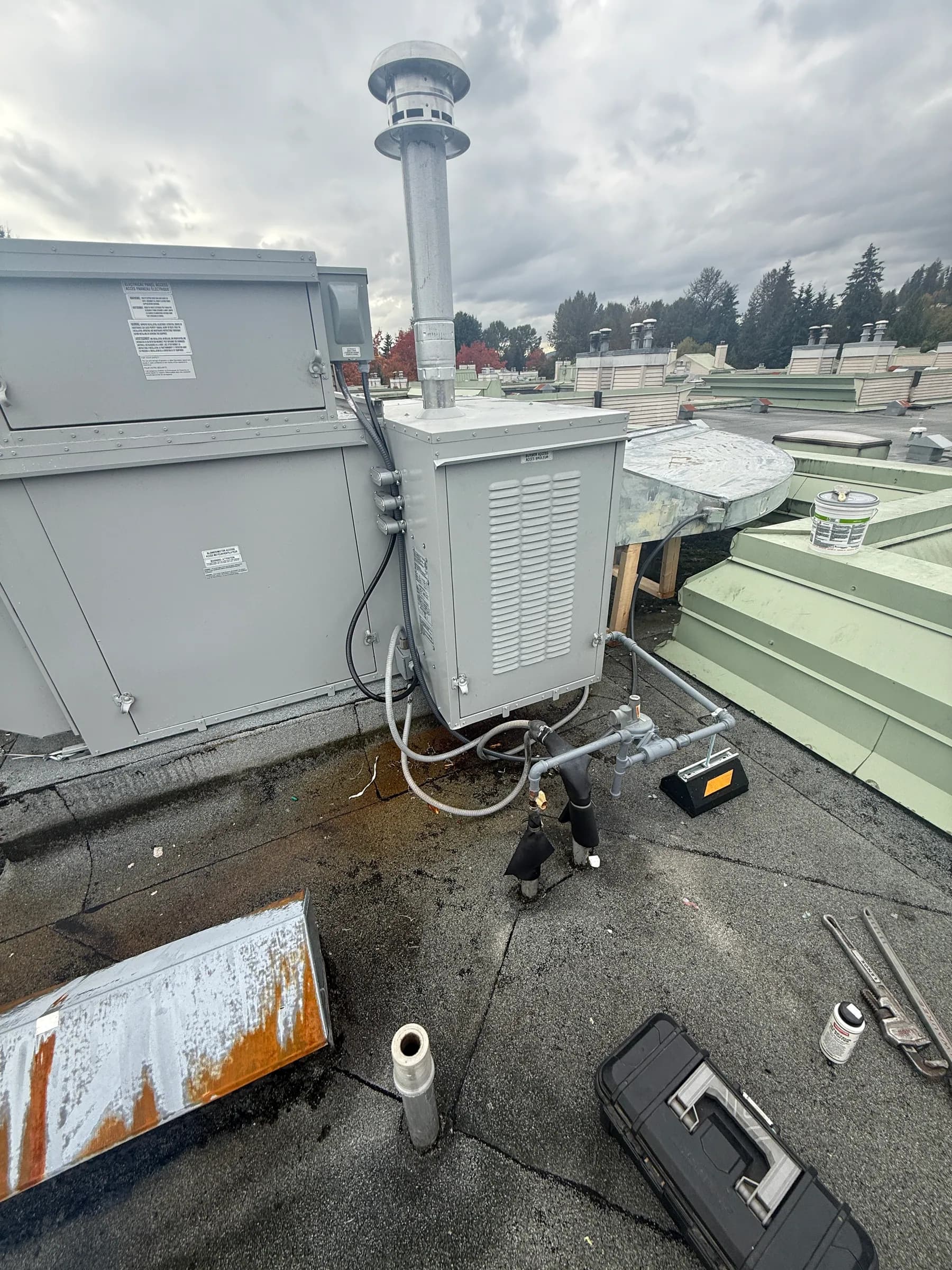 Rooftop mechanical equipment and venting at a multi-unit property