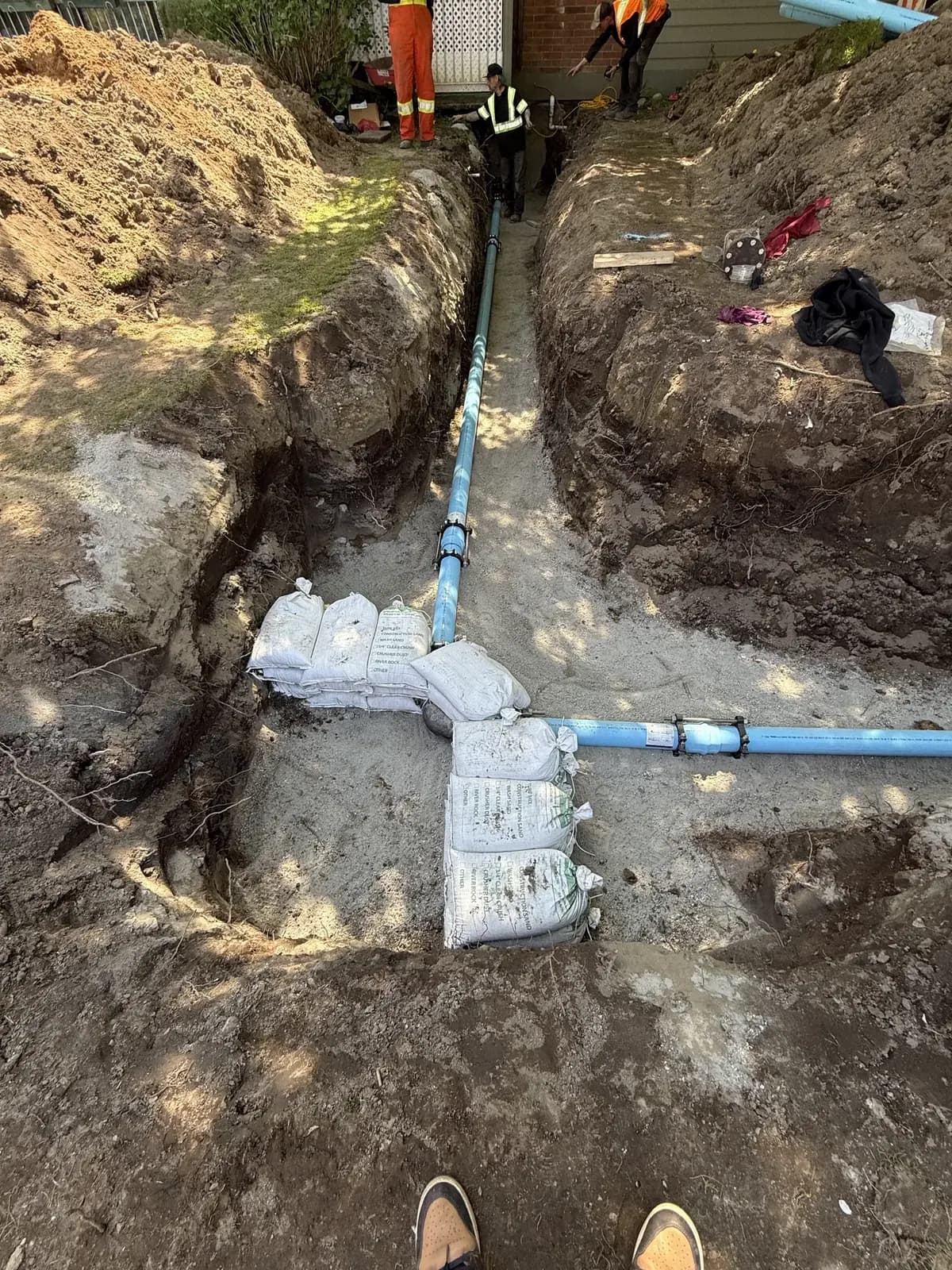 Installed blue water service running through the excavation